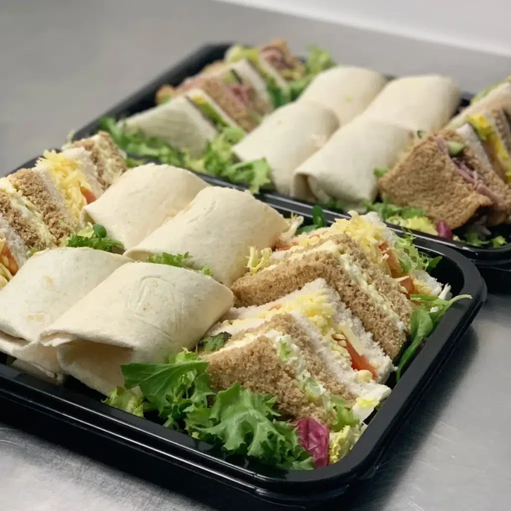Homepage 2 Assorted sandwich and wrap platter with fresh fillings and salad garnish for corporate and office catering in Bedfordshire by Xpress Catering