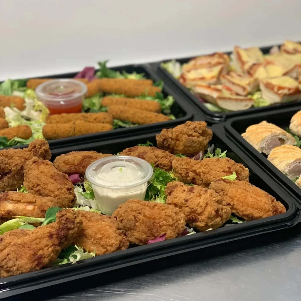 Homepage 6 Hot finger food platter with crispy chicken wings, breaded goujons and dipping sauces for parties and events in Bedfordshire by Xpress Catering