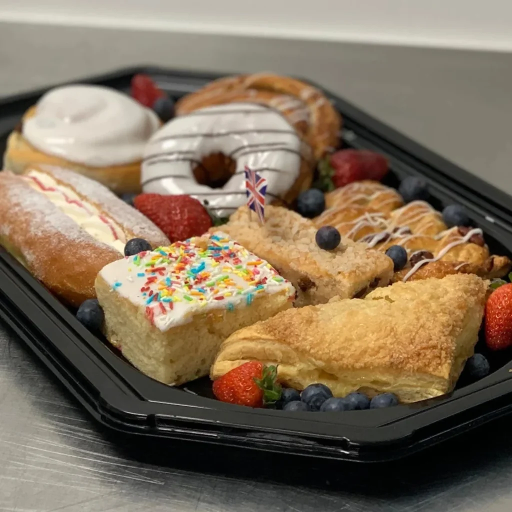 Homepage 10 Traditional afternoon tea platter with fresh scones, strawberry jam portions and Union Jack themed cupcakes from Xpress Catering Bedfordshire
